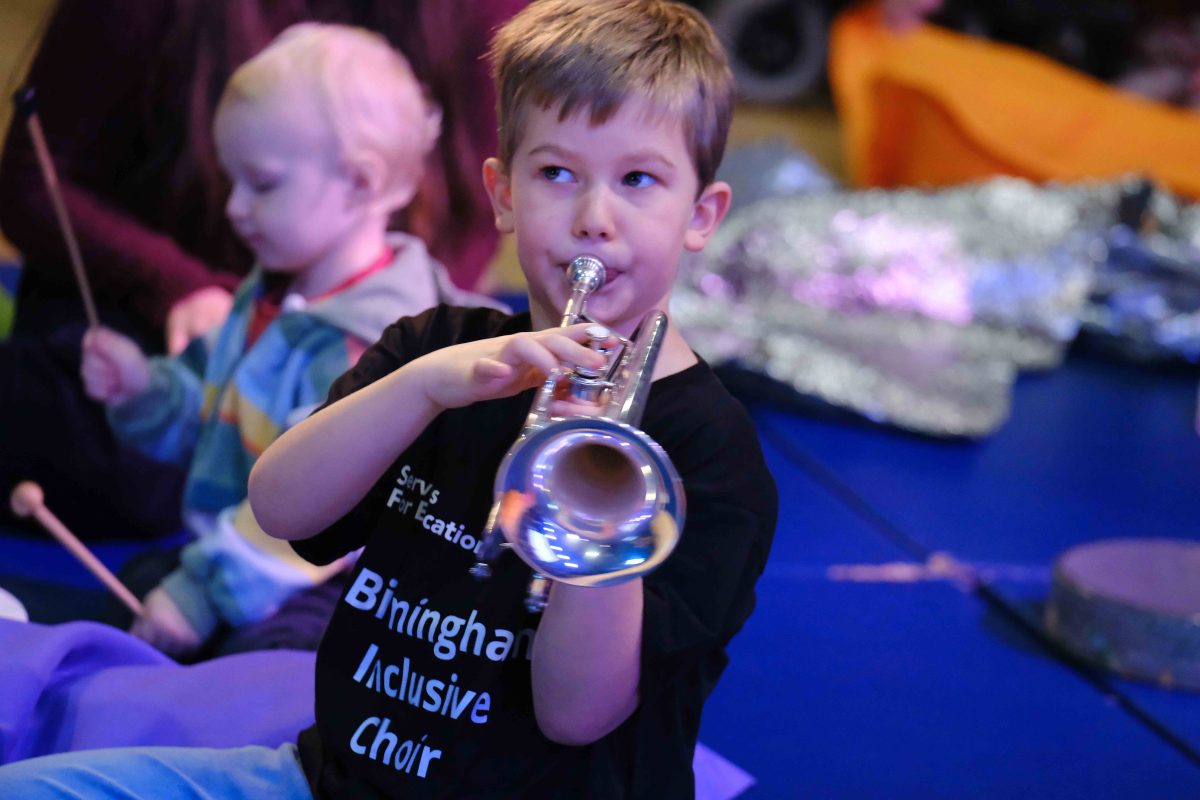 One of the members of the choir playing a trumpet